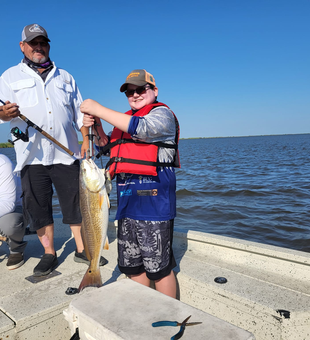 Big Redfish, bigger smiles on Bolivar Peninsula!